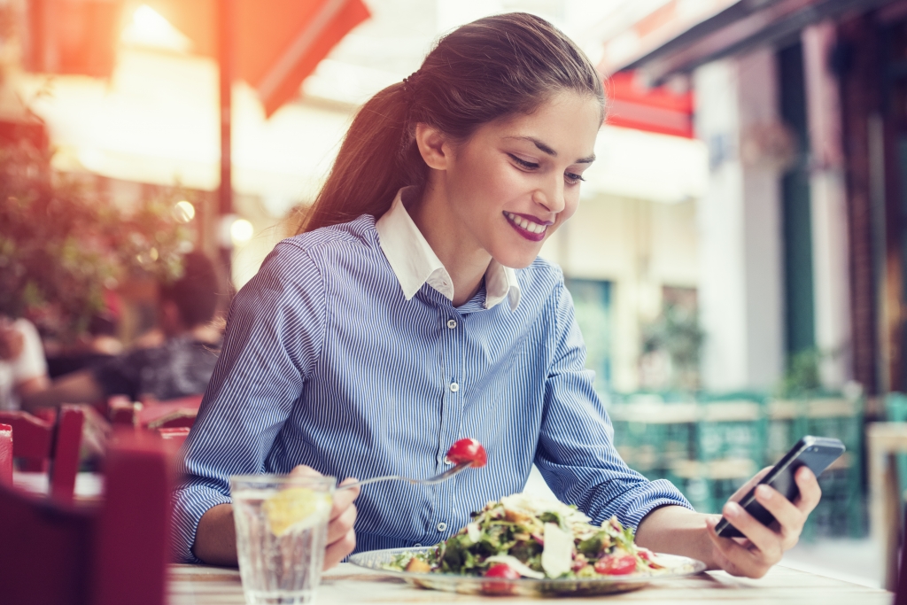 woman is eating at a restaurant